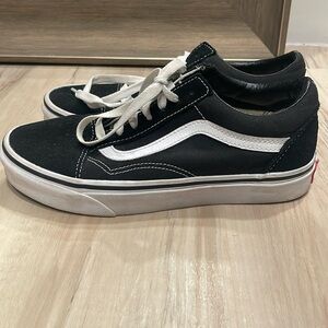 Black and white laced Vans